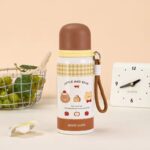 Cute Cartoon Stainless Steel Water BottleCartoon Kids Water BottleCrafty CuddleIllustrative water bottle with cartoon designs on a beige backgroundBrown
