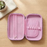 Purple Unicorn EVA Pencil PouchUnicorn EVA pencil pouch boxCrafty CuddlePink travel case with a zipper on a wooden surfacePurple Unicorn Big EVA Pouchbig pencil pouch for kidscute pencil pouch