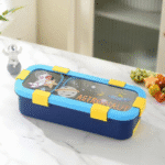 Leakproof Bento Box with Spoon ForkStainless Steel Lunch BoxCrafty CuddleChildren's lunch box with astronaut design on a white surfaceAstronaut