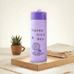 Kids Glass Water BottleCartoon Kids Water BottleCrafty CuddlePurple water bottle with 'Have a nice day' text and dinosaur illustration on a wooden surface.Purple