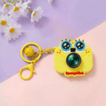 Cute Camera Shape Projector KeychainKeychainsCrafty CuddleYellow camera - shaped keychain with 'SpongeBob' branding on a pink and purple background with flowers.Light YellowCuteKeychain KawaiiAccessories KidsAccessories ReturnGiftIdeas CartoonKeychain MiniCamera BagCharm StationeryLove GiftForKids TrendingNow