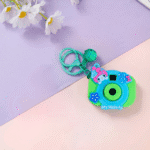Cute Camera Shape Projector KeychainKeychainsCrafty CuddleColorful toy camera with a keychain on a pastel backgroundGreenCuteKeychain KawaiiAccessories KidsAccessories ReturnGiftIdeas CartoonKeychain MiniCamera BagCharm StationeryLove GiftForKids TrendingNow