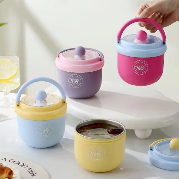 Colorful lunch box with handles on a white surface