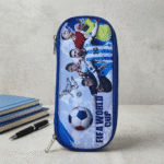 Football Theme EVA Pencil PouchPencil PouchCrafty CuddlePencil case with soccer - themed design featuring players and a ball, placed on a surface with books and a pen.Blue & GreyFootballPencilBox SportsStationery KidsStationery PencilCase SchoolSupplies BoysStationery EVAPencilBox FootballTheme BackToSchool StationeryLoverStationeryAddict